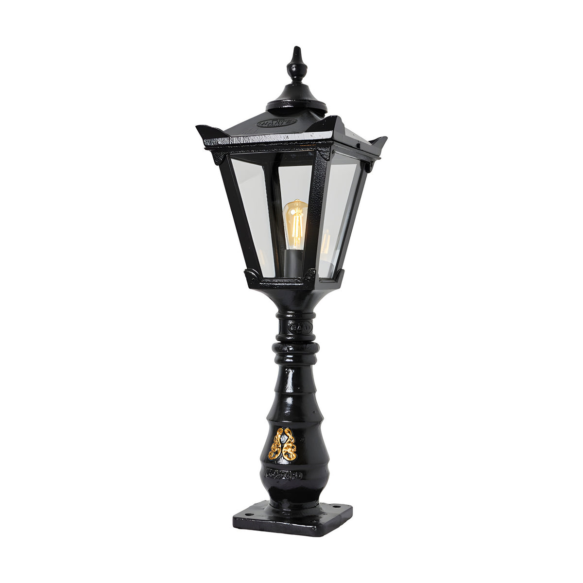 Large Victorian cast iron pedestal post light in black, tapered four-sided lantern head with stepped crown and finial on a decorative pillar base, shown against a plain white background.