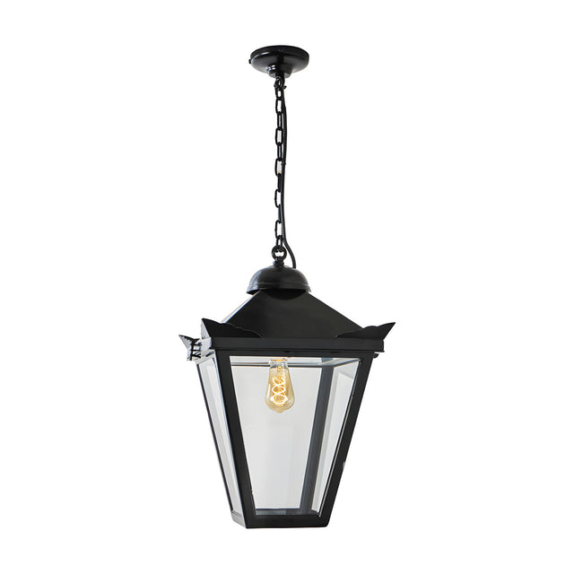 Large Victorian cast iron hanging lantern in black, tapered four-sided head with stepped crown and corner tips, suspended on a chain with ceiling rose, on a plain white background.