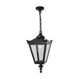 Medium Victorian cast iron hanging lantern in black, tapered four-sided glass head with stepped crown and finial, suspended from a chain, on a plain white background.