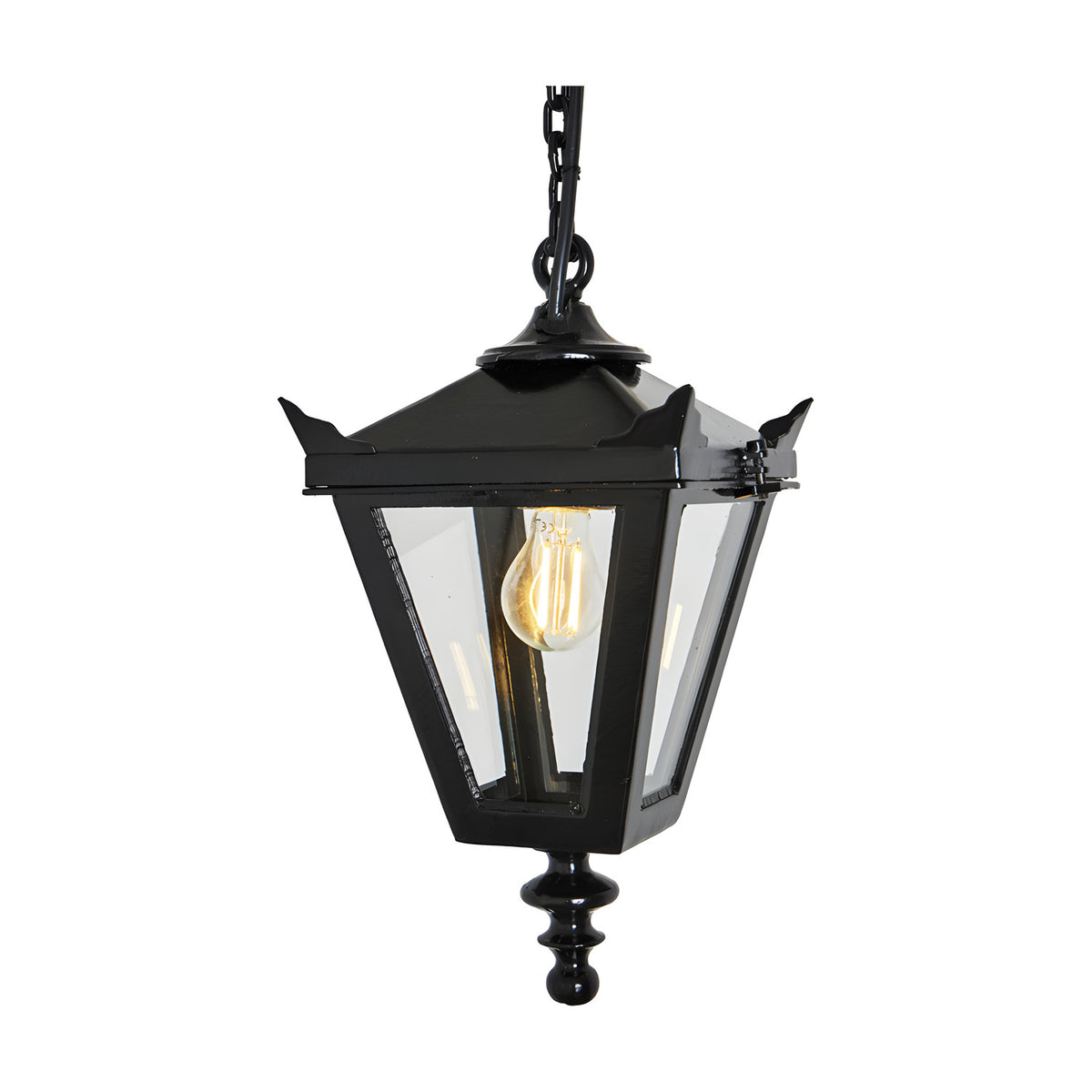 Small Victorian cast iron hanging lantern in black with tapered four-sided glass panels, stepped crown, corner tips, cast finial and hanging chain, shown on a plain white background.