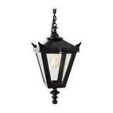 Small Victorian cast iron hanging lantern in black with tapered four-sided glass panels, corner tips, stepped crown and cast finial, suspended on a chain against a plain white background.