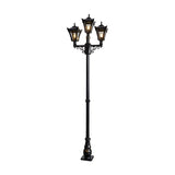 Victorian cast iron triple-headed lamp post in black, 2.6m tall with three tapered lantern heads on scrolled arms atop a slender fluted pole and decorative base, shown on a plain white background.