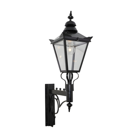Large Victorian wall lantern in black, tapered four-sided glass head with stepped crown and finial, mounted on a scroll bracket, E27 bulb visible, plain white background.