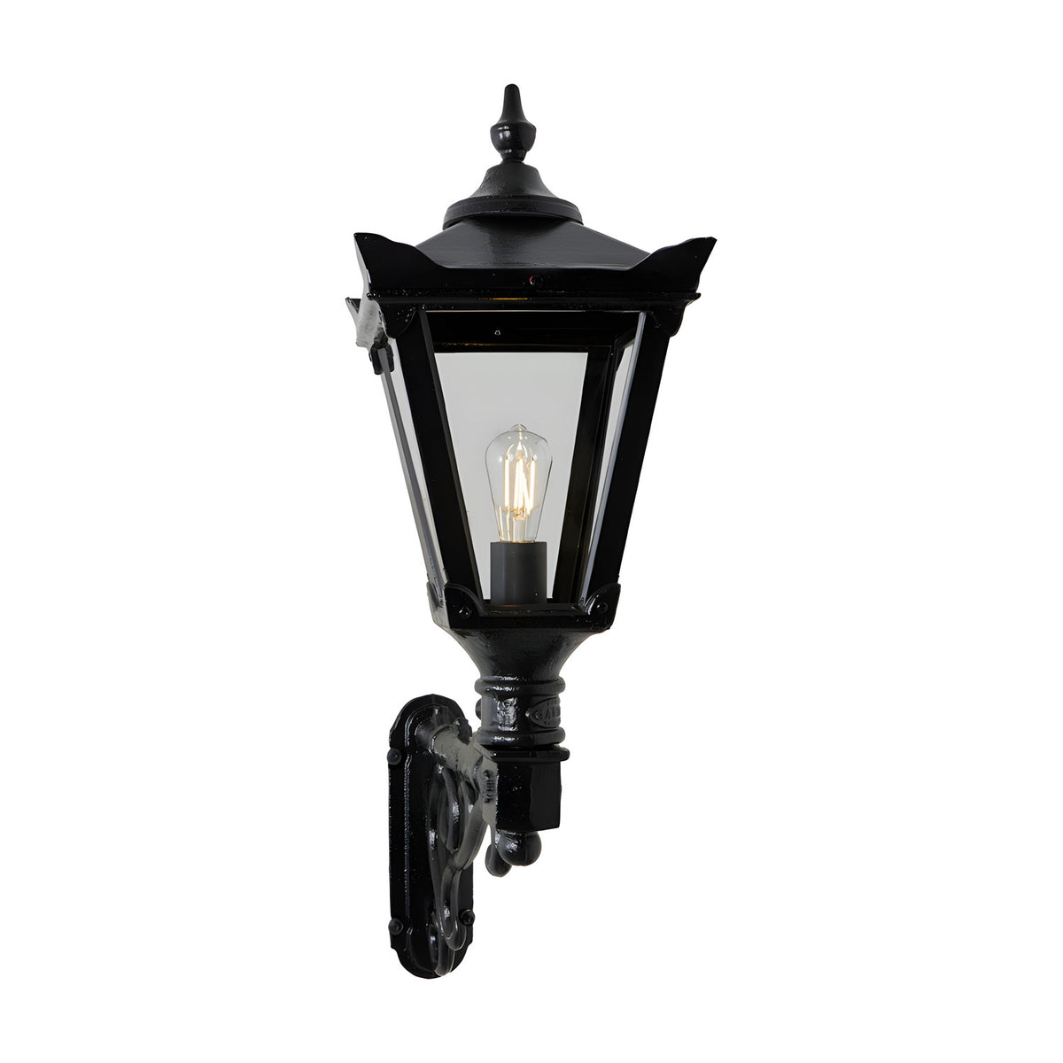 Medium Victorian wall lantern in black, tapered four-sided glass shade with cast finial, mounted on a decorative scroll bracket, single E27 bulb, shown on a plain white background.