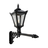 Victorian cast iron wall lantern in black with a tapered four-sided glass head, stepped crown, finial top, and scrolled bracket on a long extended arm, shown on a plain white background.