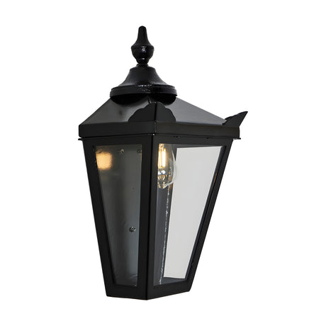 Large Victorian Cast Iron Half Lantern Wall Light in black, with pointed finial, peaked roof, clear glass panels and visible E27 bulb, shown on a plain white background.