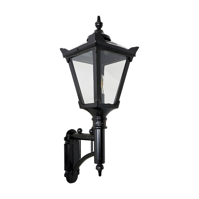 Victorian cast iron wall lantern in black with a tapered glass panel head, stepped crown, cast finial, and short mounting arm, shown on a plain white background.