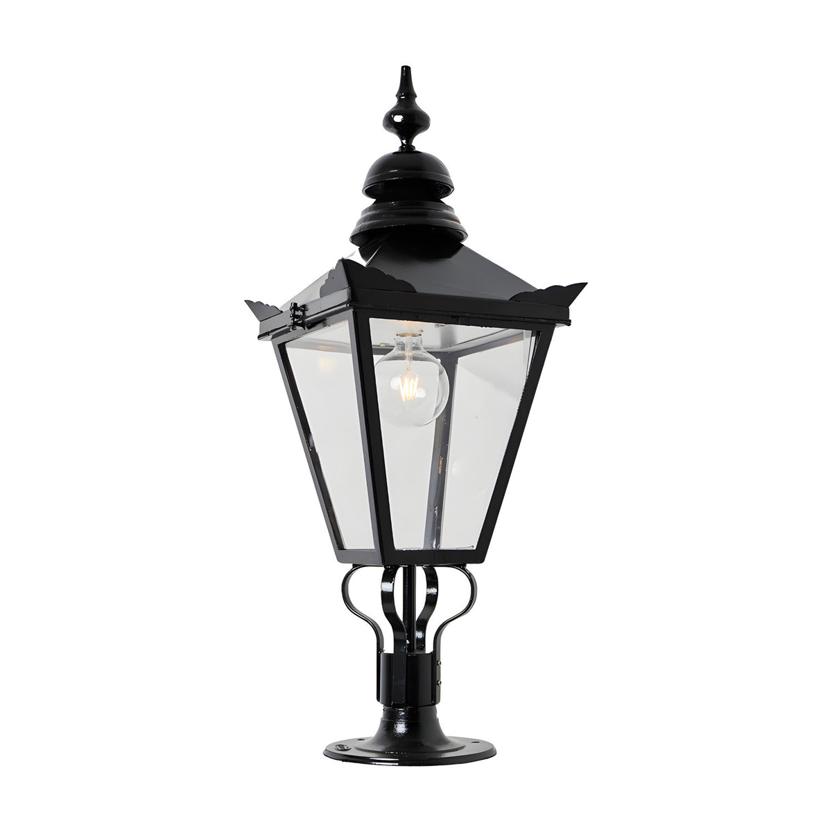 Large Victorian pillar light in black cast iron with a tapered four-sided glass head, stepped crown, corner tips, ornate finial, and pier cap base, shown on a plain white background.