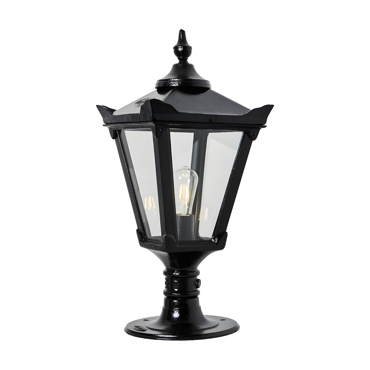 Medium Victorian cast iron pillar light in black with a tapered four-sided glass head, stepped crown, corner tips and cast finial, mounted on a pedestal base, shown against a white background.