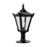 Medium Victorian cast iron pillar light in black with a tapered four-sided glass head, stepped crown, corner tips and cast finial, mounted on a pedestal base, shown against a white background.