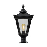 Large Victorian cast iron pillar light in black with tapered four-sided glass panels, stepped crown finial, and pier cap base, shown on a plain white background.