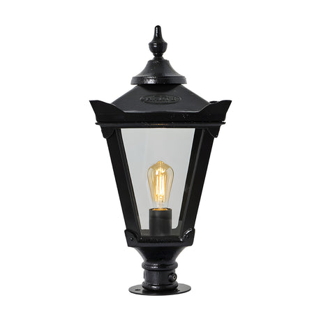Large Victorian cast iron pillar light in black with tapered four-sided glass panels, stepped crown finial, and pier cap base, shown on a plain white background.