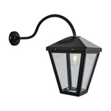 Contemporary Barn Wall Lantern in black steel with a tapered glass panel shade, curved gooseneck arm, wall mounting plate and visible E27 bulb, shown on a plain white background.