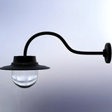 Contemporary black wall lantern on a curved goose neck bracket, with a wide flat top and clear domed glass shade, shown against a plain light background.