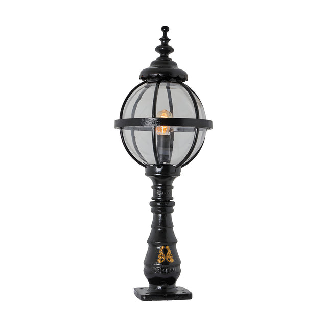 Large Victorian cast iron globe pedestal post light in black, with a banded glass globe shade, ornate finial top, decorative column base and square mounting plate, shown on a plain white background.