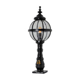 Large Victorian cast iron globe pedestal post light in black, featuring a spherical glass shade in a banded cage on a traditional turned base, shown on a plain white background.