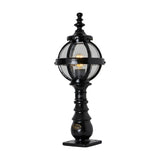 Small Victorian cast iron globe pedestal post light in black, single-light fixture with clear glass globe in a banded cage on a decorative base, shown on a plain white background.