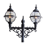 Victorian-style cast iron double-headed lamp post in black, with two globe lanterns in banded cages atop scrolled brackets, shown against a plain white background.