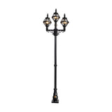 Victorian-style triple-headed lamp post in black cast iron, 2.6m tall, with three globe lanterns in banded cages atop a scrolled crossarm and fluted base, shown on a plain white background.