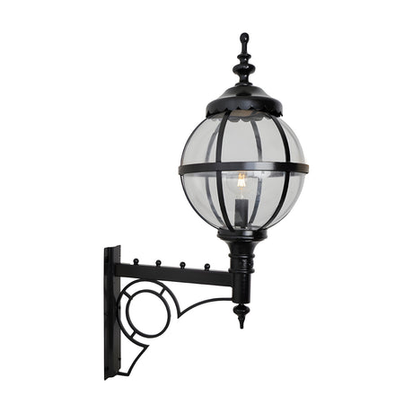 Large Victorian Globe Wall Lantern in black, a clear glass globe held in a banded iron cage on a decorative scroll bracket, shown on a plain white background.