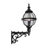 Medium Victorian globe wall lantern in black with a caged glass sphere on an ornate scroll bracket, shown on a plain white background.