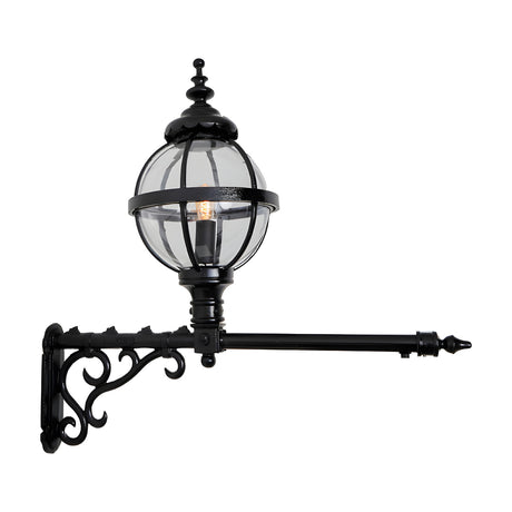 Victorian Cast Iron Globe Wall Lantern in black, featuring a caged glass globe shade on an extended scrolled wall bracket, shown on a plain white background.