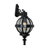 Small Victorian cast iron downturned globe wall lantern in black, with a banded cage design, ornate mounting bracket, and finial base, shown on a plain white background.