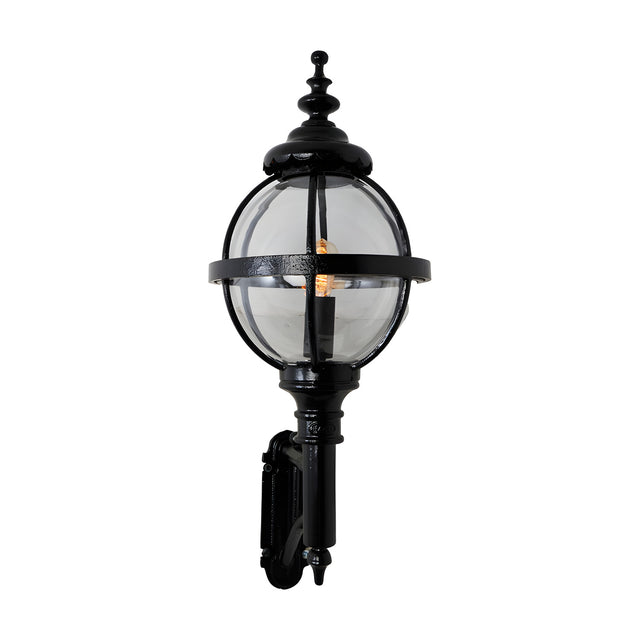 Victorian cast iron globe wall lantern in black, with clear polycarbonate glazing in a banded cage, mounted on a short arm, shown against a plain white background.
