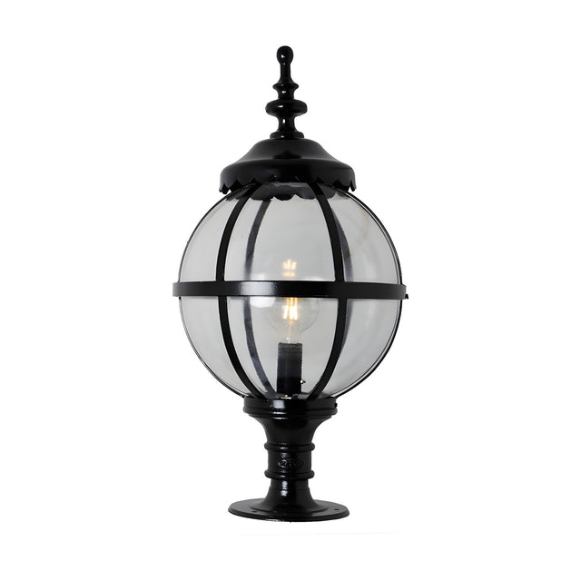 Large Victorian Globe Pillar Light in black, a clear glass globe held in a banded cast iron cage with ornate finial, mounted on a pedestal base, shown on a plain white background.