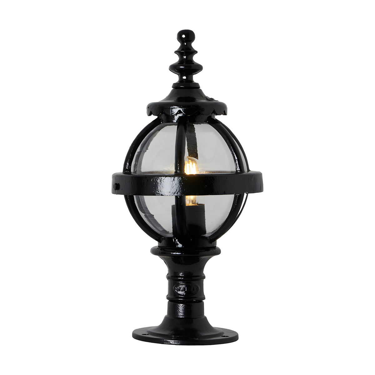 Small Victorian Globe Pillar Light in black, cast iron banded cage with clear glass globe on a decorative pedestal base, lit bulb visible, plain white background.