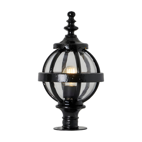 Small Victorian Globe Pillar Light in black, a cast iron globe with banded cage design and ornate finial, glass panels and lit bulb visible, on a plain white background.