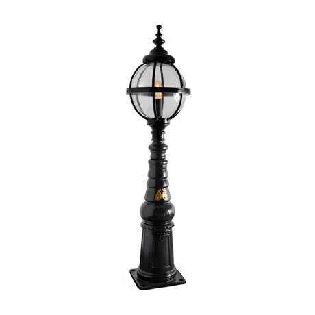 Victorian Manor cast iron globe pedestal post light in black, featuring a banded globe cage on a traditional column base with square footplate, on a plain white background.
