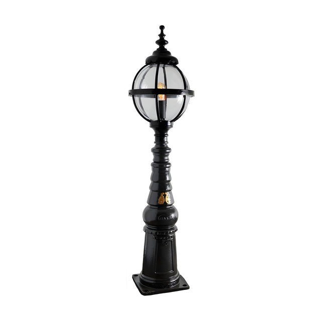 Victorian Manor cast iron globe pedestal post light in black, featuring a banded globe cage on a traditional column base with square footplate, on a plain white background.