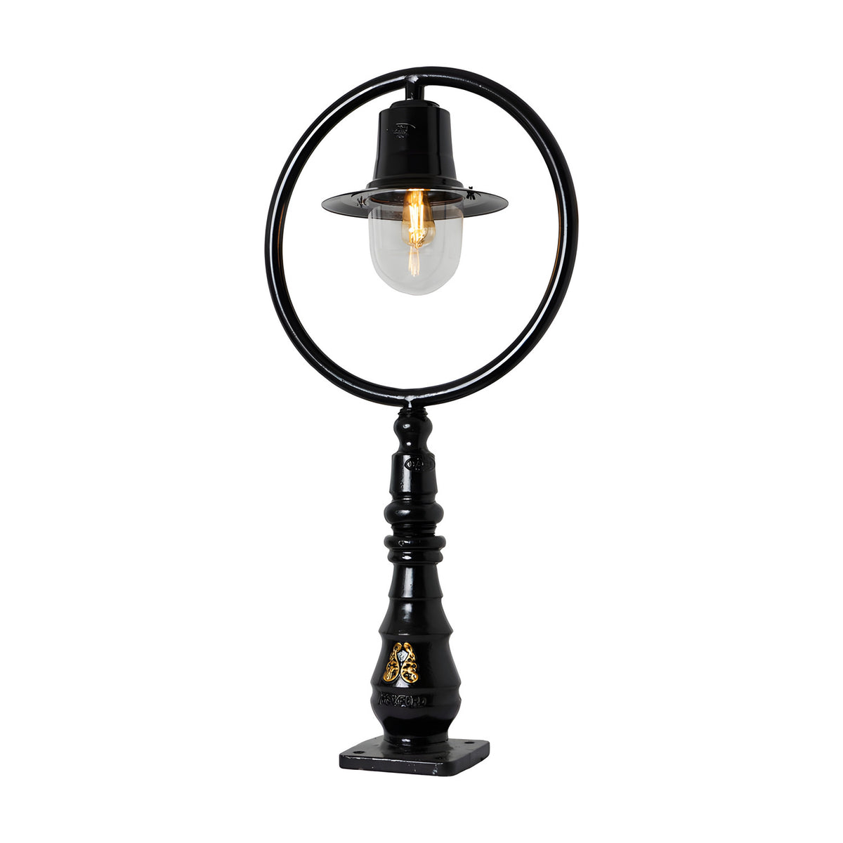 Large black cast iron railway-style pedestal post light with hoop frame, spun shade, clear glass dome, and decorative base with square fixing plate, on a white background.
