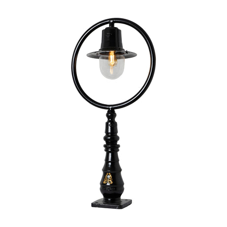 Large black cast iron railway-style pedestal post light with hoop frame, spun shade, clear glass dome, and decorative base with square fixing plate, on a white background.