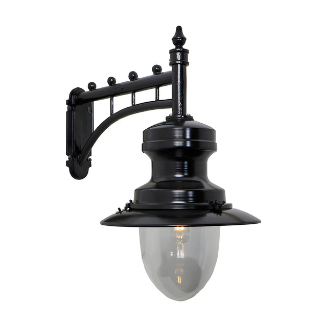 Large railway style outdoor wall lantern in black, with a trussed cast arm, spun metal shade and clear glass dome, shown on a plain white background.