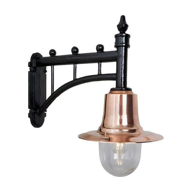 Medium railway-style wall lantern with a black cast trussed arm, copper cone shade, and clear glass dome, shown on a plain white background.