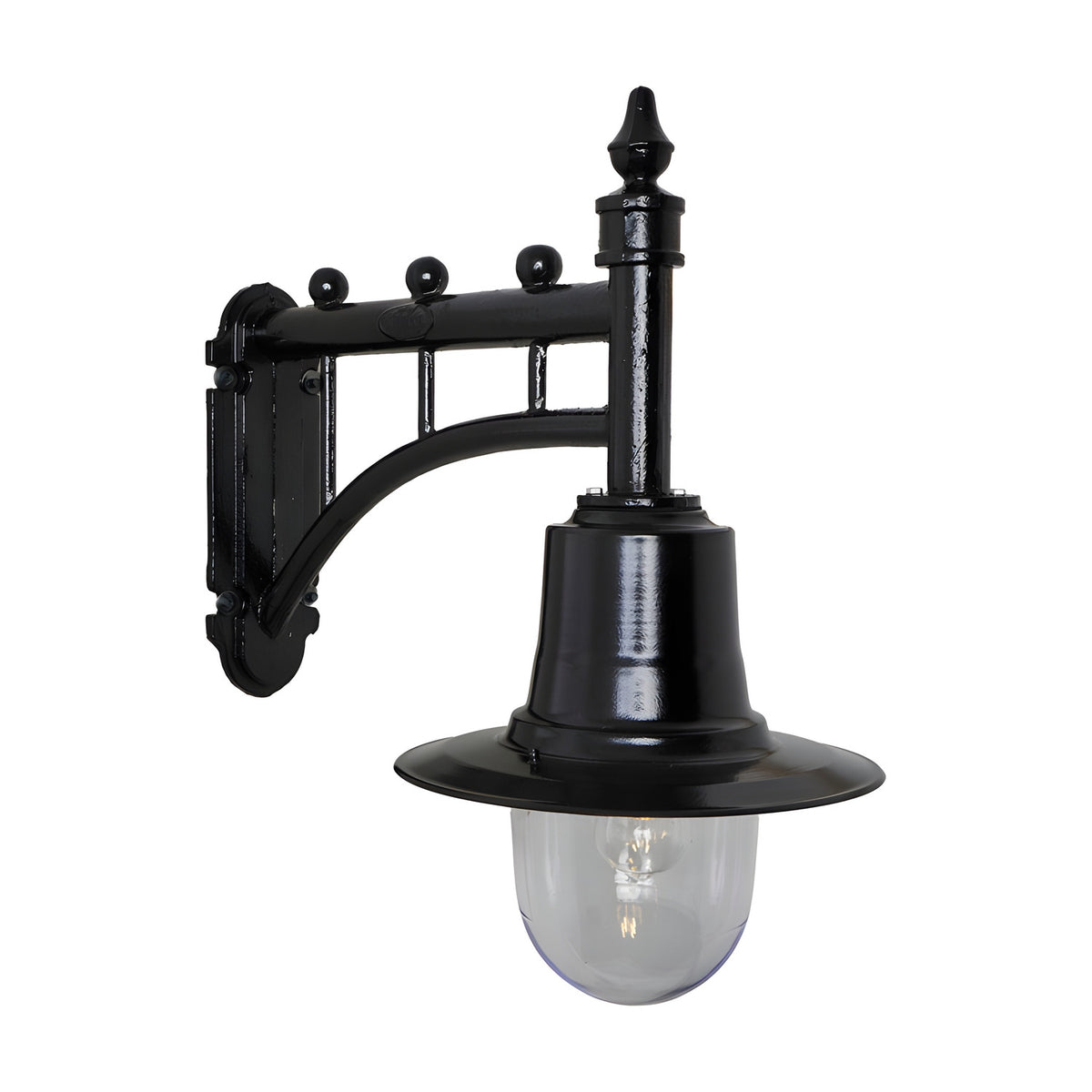 Medium Railway Style Wall Lantern in black on a decorative cast arm bracket with spun metal shade and clear glass dome, shown against a plain white background.