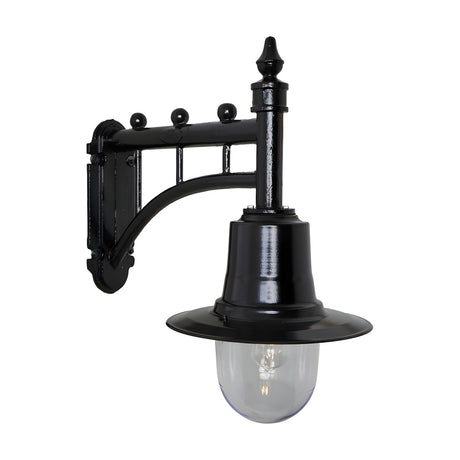 Medium Railway Style Wall Lantern in black on a decorative cast arm bracket with spun metal shade and clear glass dome, shown against a plain white background.