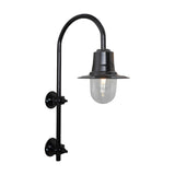 Large vintage wall lantern in black on a goose neck bracket, with a teardrop metal shade over a clear glass dome and lit bulb, shown on a plain white background.