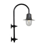Large vintage wall lantern on a black goose neck bracket, with a teardrop metal shade over a clear glass dome, shown against a plain white background.