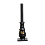 Georgian cast iron lamp post in black with fluted tapered base, gold decorative motif, and square mounting plate, plain black upper post, shown on a white background.