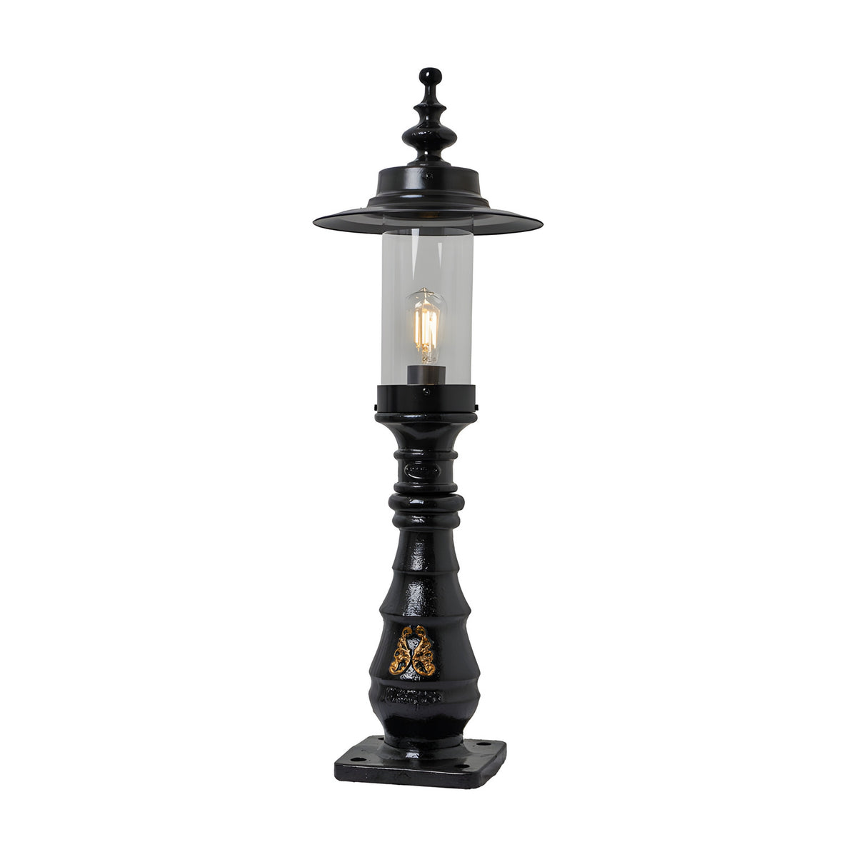 Large Georgian cast iron pedestal post light in black with clear glass shade, decorative crown top, ornate column detail, and square base plate on a plain white background.