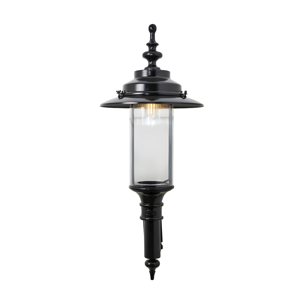 Large Georgian cast iron outdoor wall lantern in black, single-light fixture with clear cylindrical glass panel and ornate finial top, shown on a plain white background.