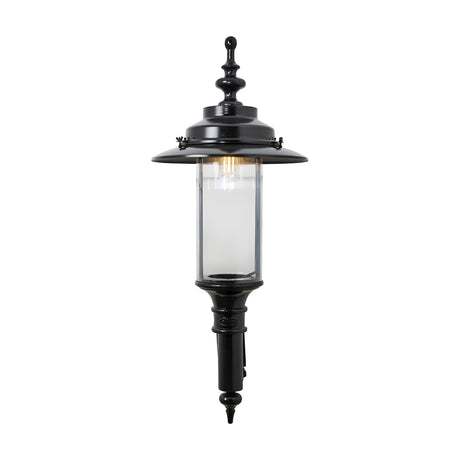 Large Georgian cast iron outdoor wall lantern in black, single-light fixture with clear cylindrical glass panel and ornate finial top, shown on a plain white background.