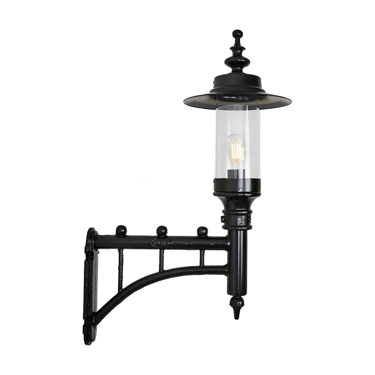 Medium Georgian Cast Iron Wall Lantern in black with a decorative scroll bracket, clear glass cylinder shade, and visible bulb, shown on a plain white background.
