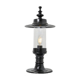Large Georgian cast iron pillar light in black with a shallow crown top, clear cylindrical glass shade, exposed bulb, and round mounting base, shown on a plain white background.