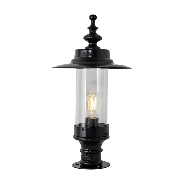 Large Georgian cast iron pillar light in black with a shallow crown-shaped top, clear cylindrical glass panel, single E27 bulb, and a wide flared base, shown on a plain white background.