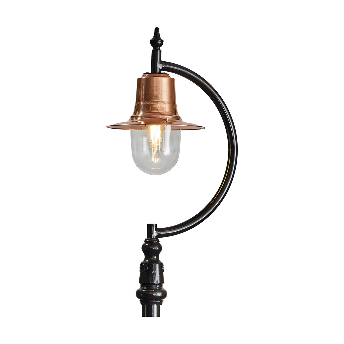 Vintage Cast Iron Lamp Post with curved black gooseneck arm, copper teardrop shade over a clear glass dome and lit bulb, ornate black base, on a plain white background.