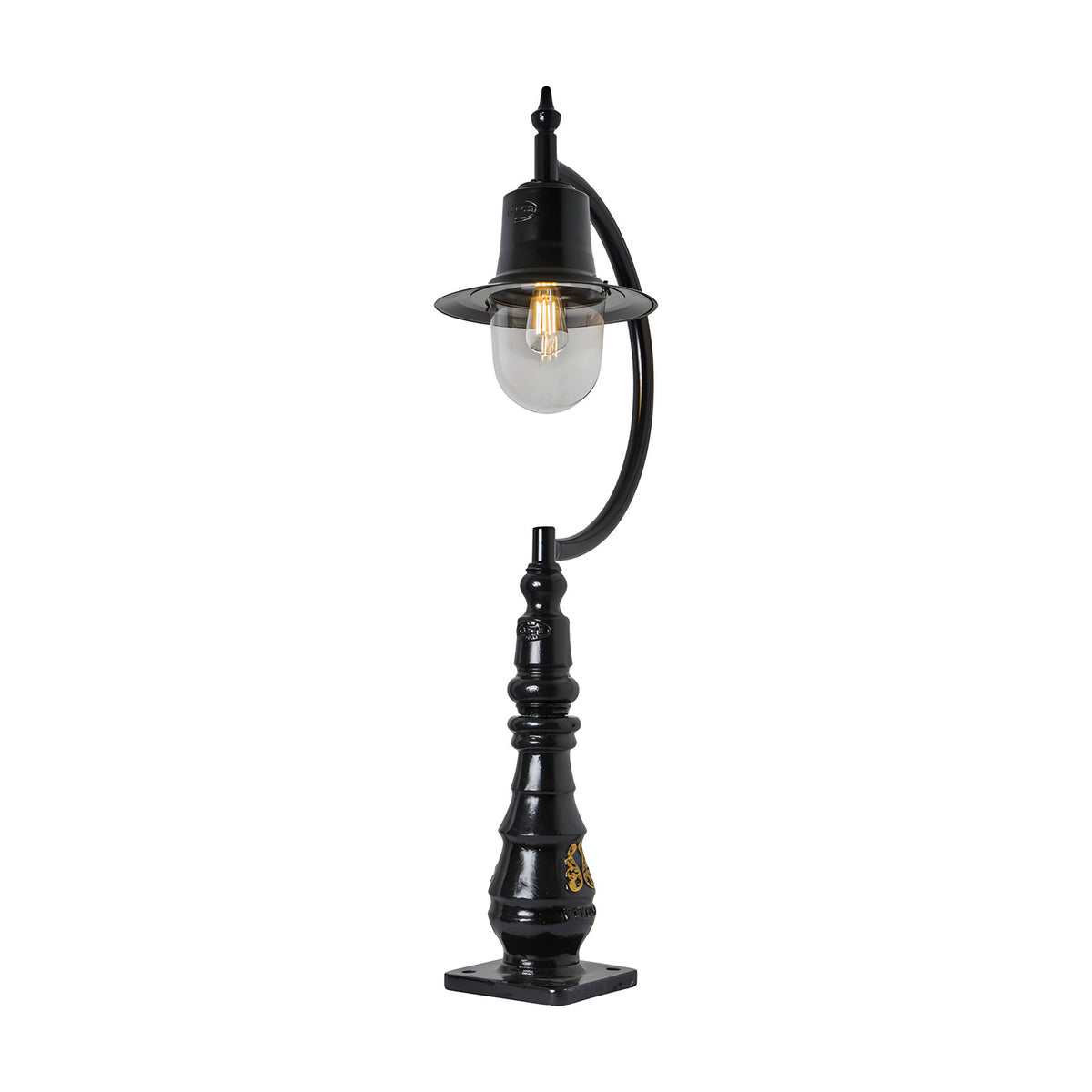 Large vintage black cast iron pedestal post light with curved gooseneck arm, teardrop shade over clear glass dome, single E27 bulb, and decorative pillar base with square mount.